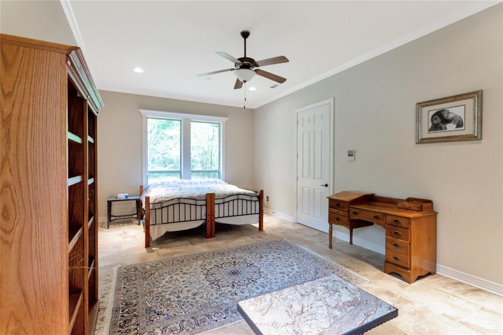 8350 FM 346 Flint, TX 75762 - Photo 16 of 39 a bedroom with a bed and a chandelier