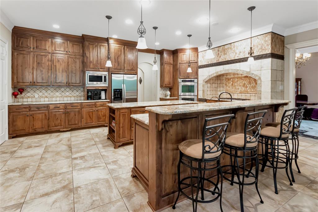 8350 FM 346 Flint, TX 75762 - Photo 19 of 39 a kitchen with stainless steel appliances granite countertop a sink and a refrigerator