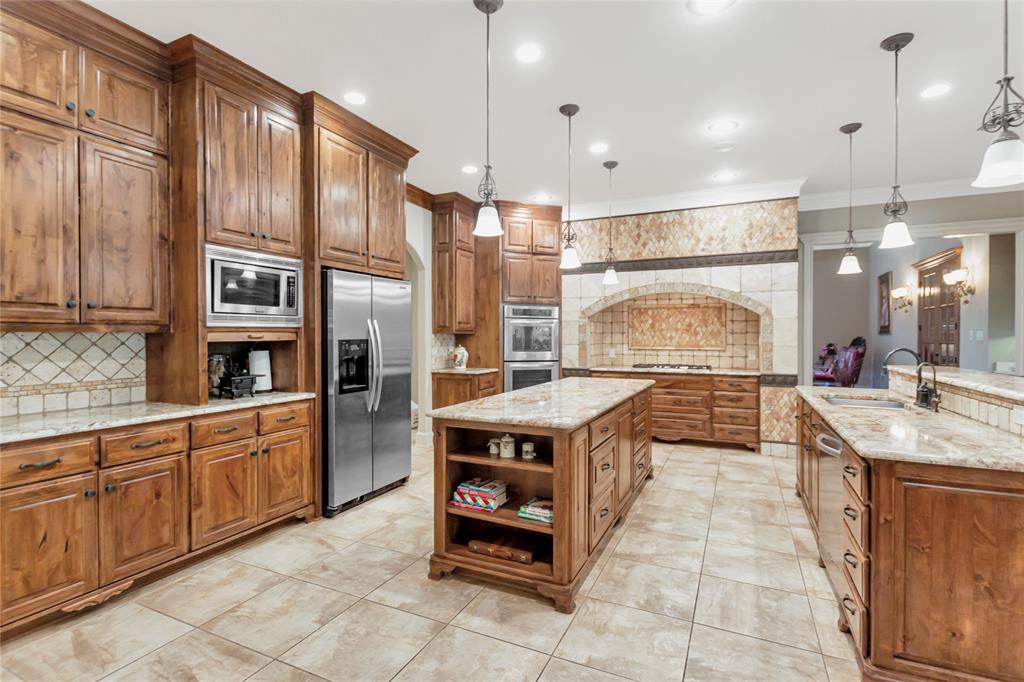 8350 FM 346 Flint, TX 75762 - Photo 20 of 39 a large kitchen with stainless steel appliances granite countertop a stove a sink and a refrigerator