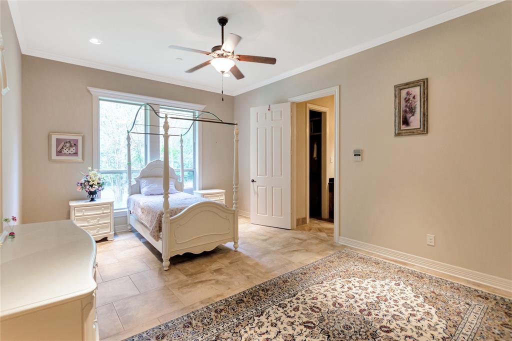 8350 FM 346 Flint, TX 75762 - Photo 8 of 39 a spacious bedroom with a bed painting on wall and a large window