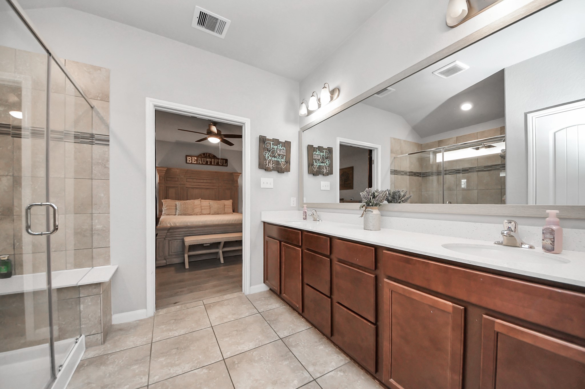 550 Winburn Tide Lane La Porte, TX 77571 - Photo 21 of 40 a spacious bathroom with a double vanity sink a mirror and a shower