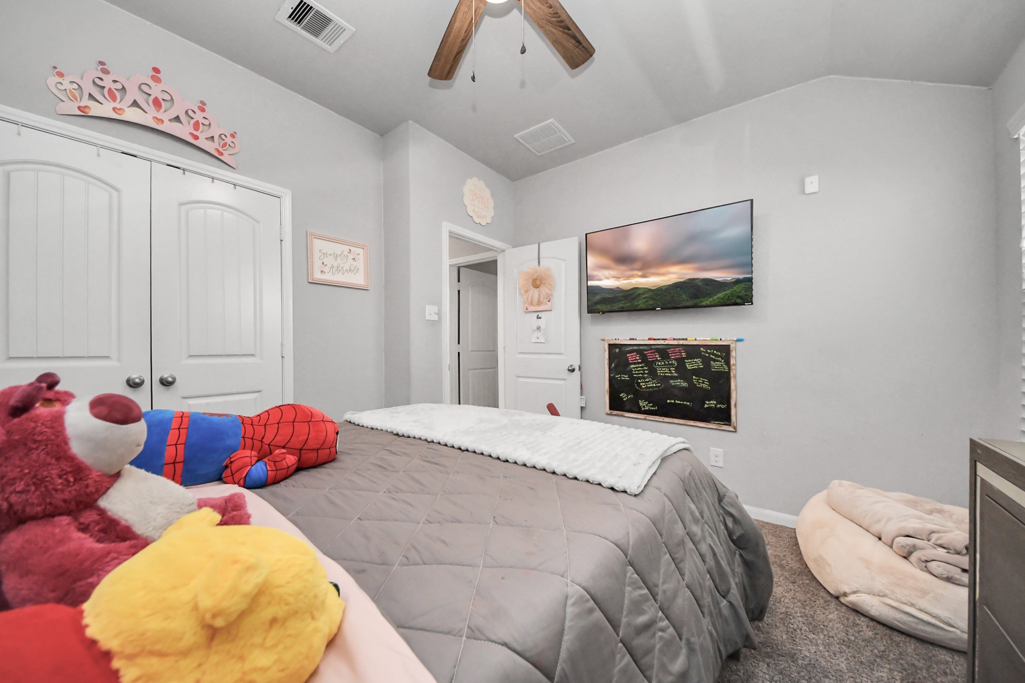 550 Winburn Tide Lane La Porte, TX 77571 - Photo 29 of 40 a bedroom with a bed and a flat screen tv