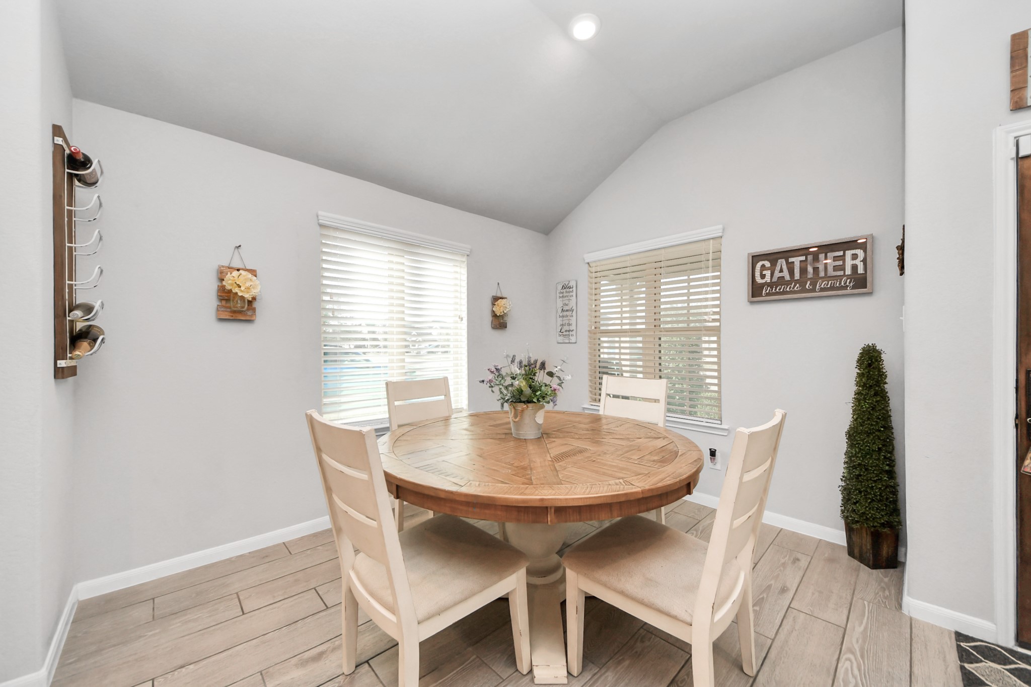 550 Winburn Tide Lane La Porte, TX 77571 - Photo 8 of 40 a view of a dining room with furniture and wooden floor