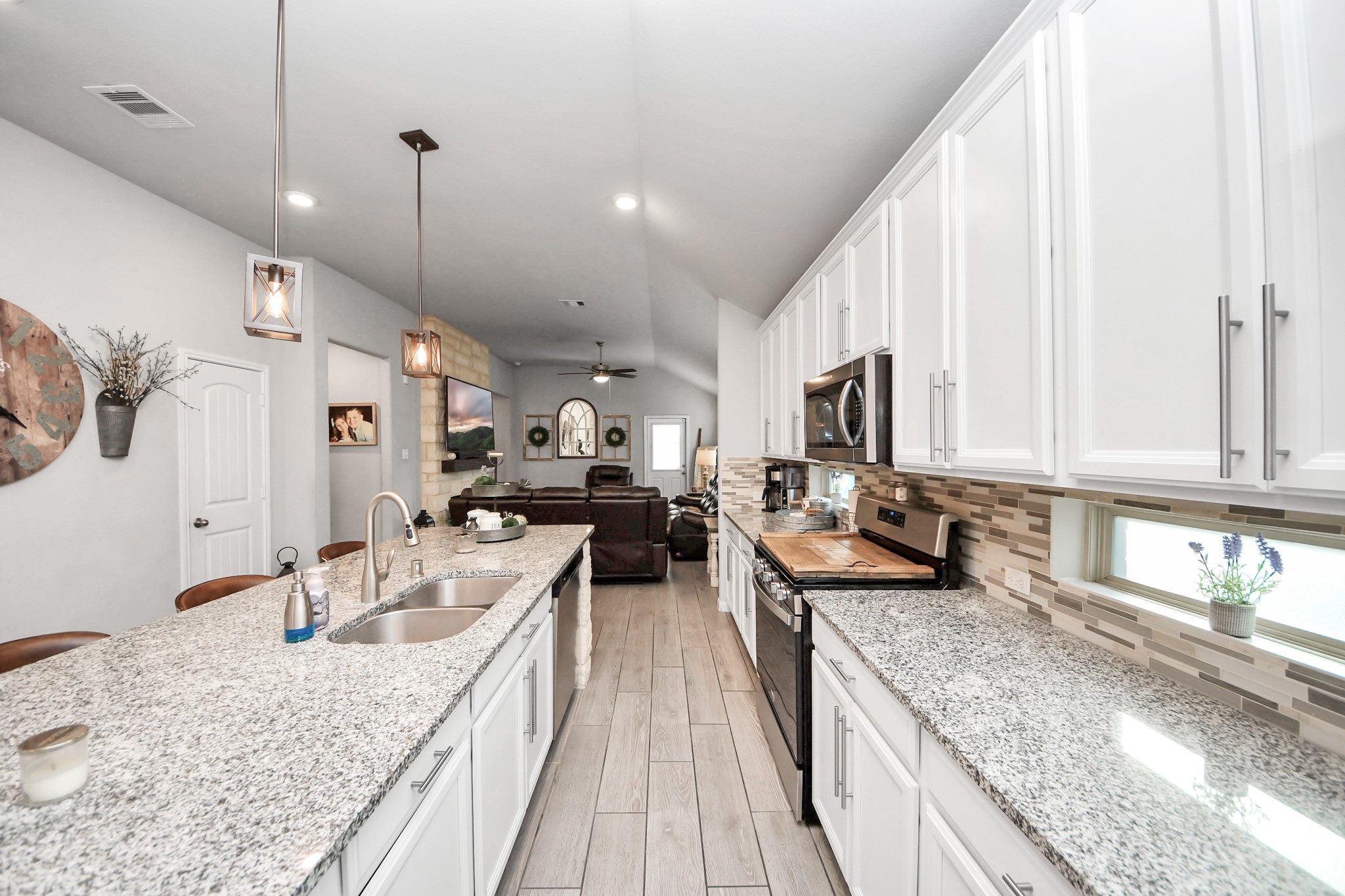 550 Winburn Tide Lane La Porte, TX 77571 - Photo 10 of 40 a kitchen with stainless steel appliances granite countertop sink stove and refrigerator