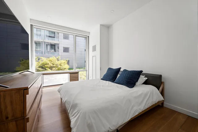 a bathroom with a bathtub sink and mirror