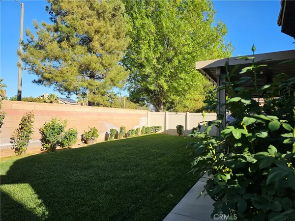 a view of a house with a yard porch and sitting area