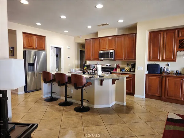 a kitchen with a sink a counter top space and appliances