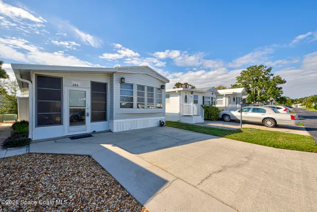 a view of a house with a yard and garage