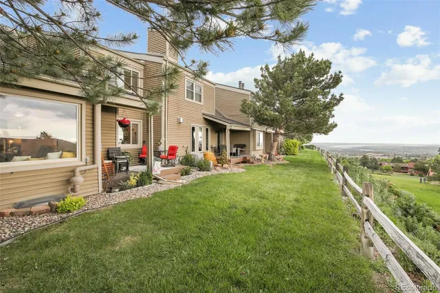 a view of a house with a yard porch and sitting area