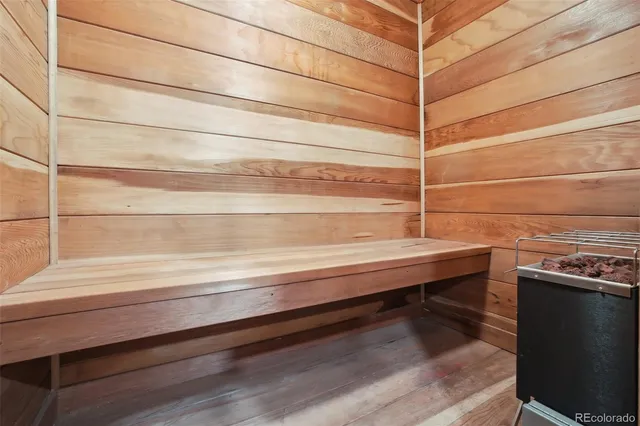 a view of a room with an empty space and wooden floor