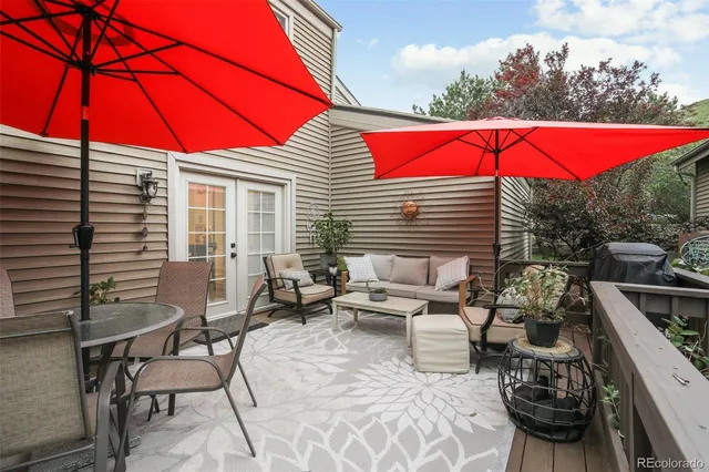 a view of a backyard with sitting area