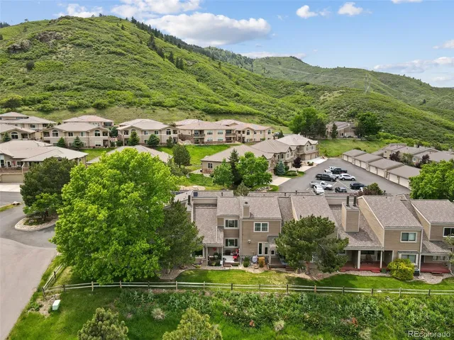 an aerial view of residential houses with outdoor space