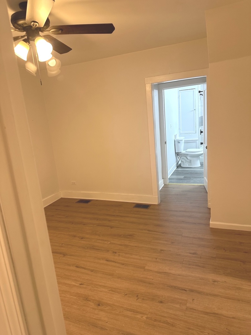2318 Washington Street, Unit 1 Waukegan, IL 60085 - Photo 6 of 8 a view of a room with wooden floor