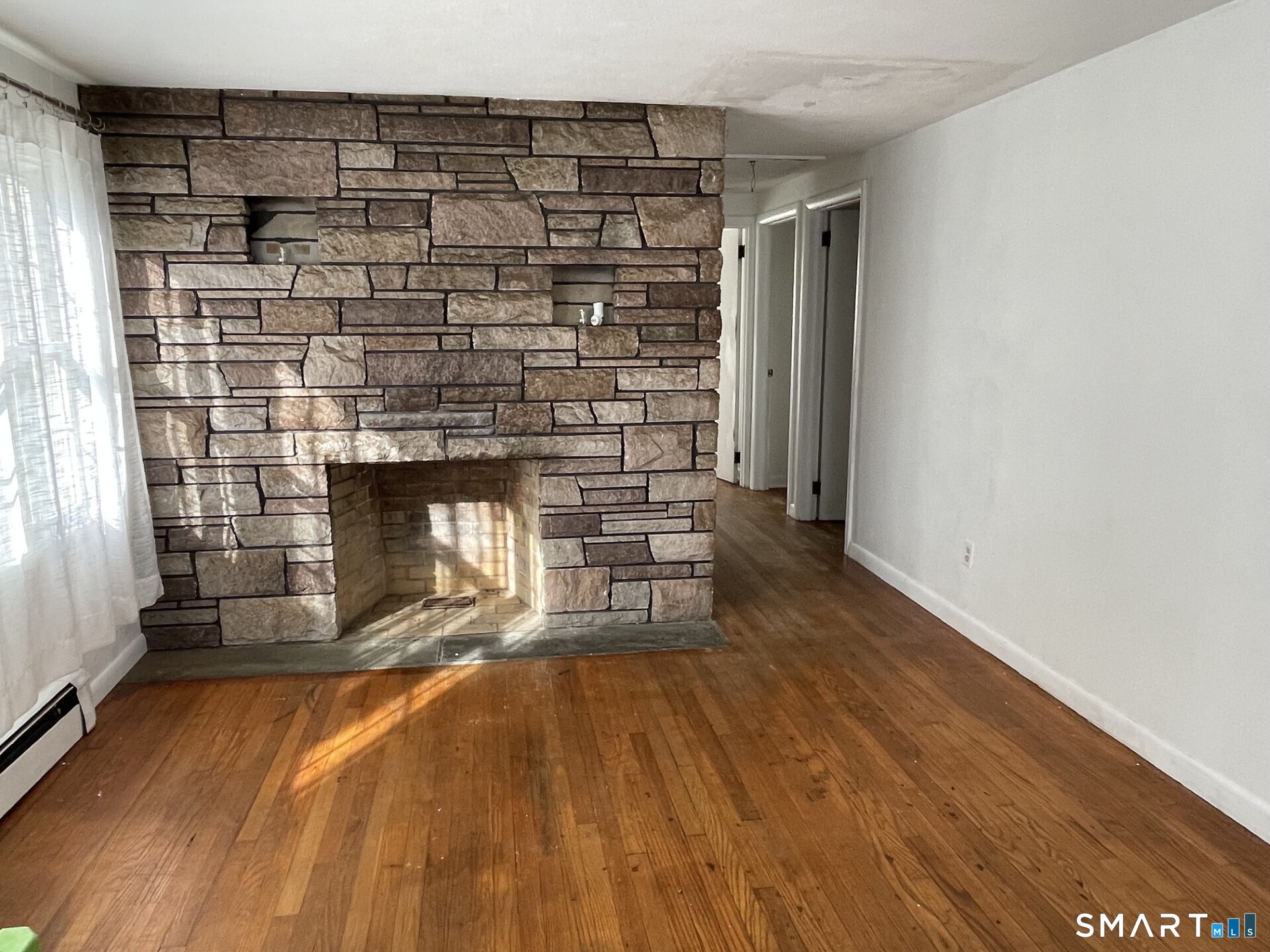 8 Prospect Hill Deep River, CT 06417 - Photo 5 of 16 a room with a fireplace