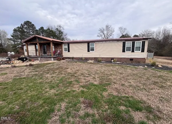 a front view of a house with yard