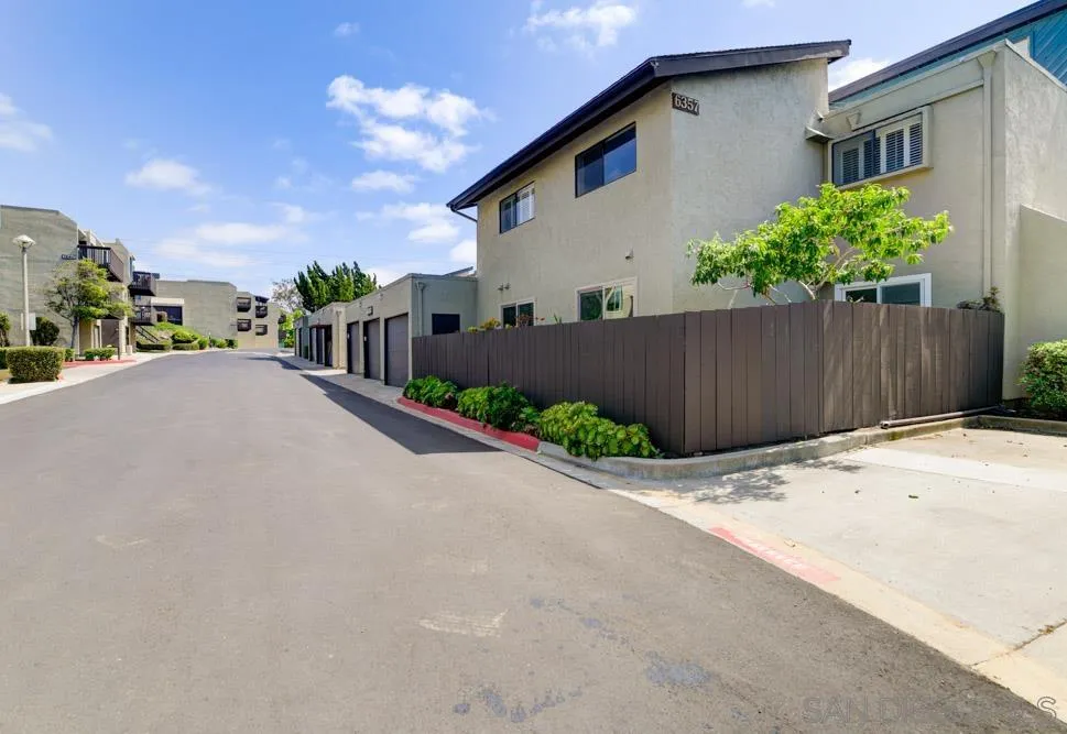 6357 Rancho Mission Road, Unit 1 San Diego, CA 92108 - Photo 23 of 28 a view of a house with a street