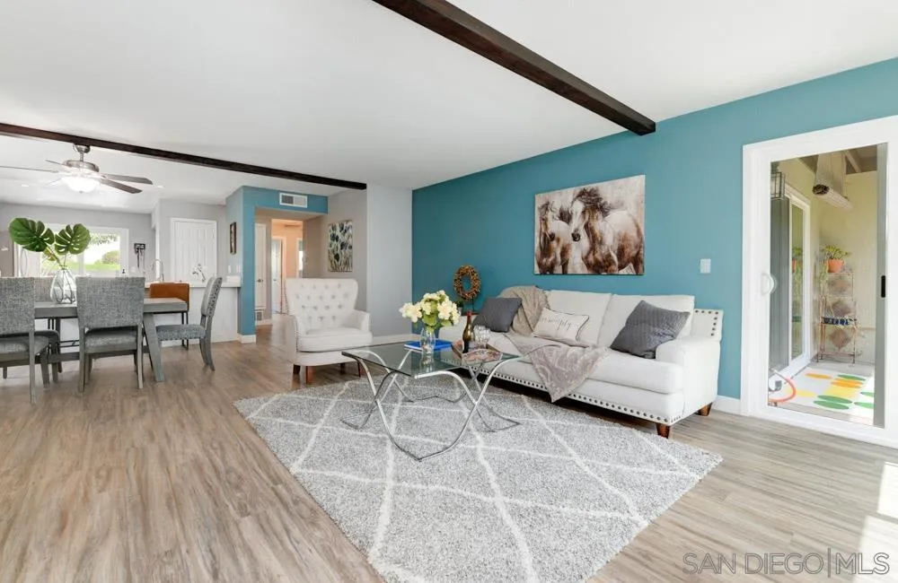 6357 Rancho Mission Road, Unit 1 San Diego, CA 92108 - Photo 3 of 28 a living room with furniture and wooden floor
