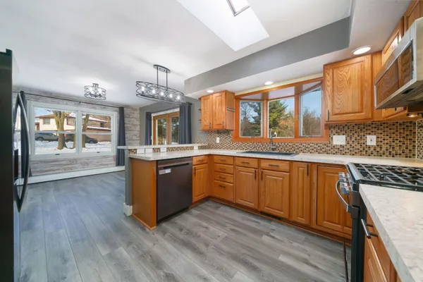 a bathroom with a toilet a sink and a mirror