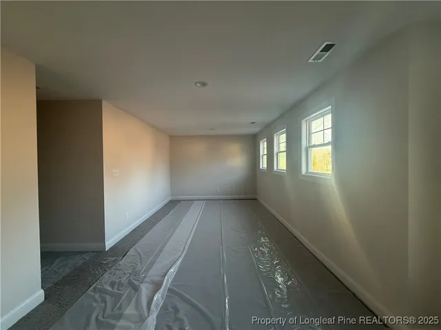 an empty room with windows