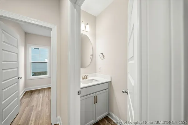 a bathroom with a sink a mirror and a shower