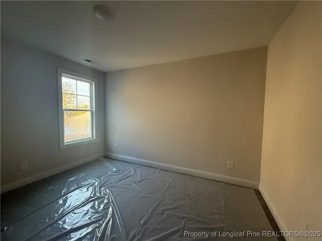 a view of a yard with large trees