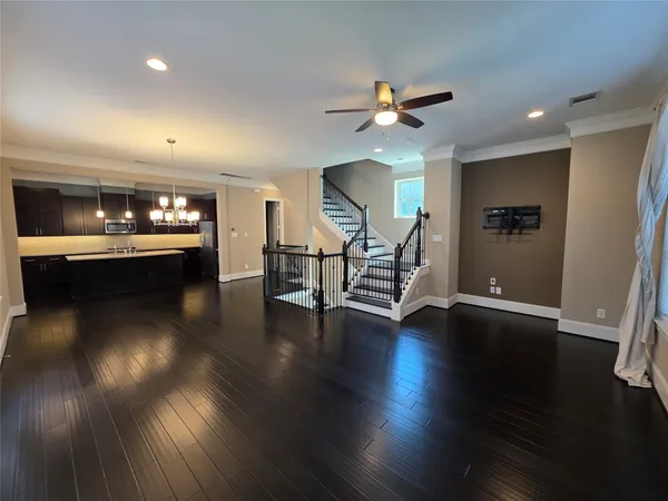a view of balcony with wooden floor and fence
