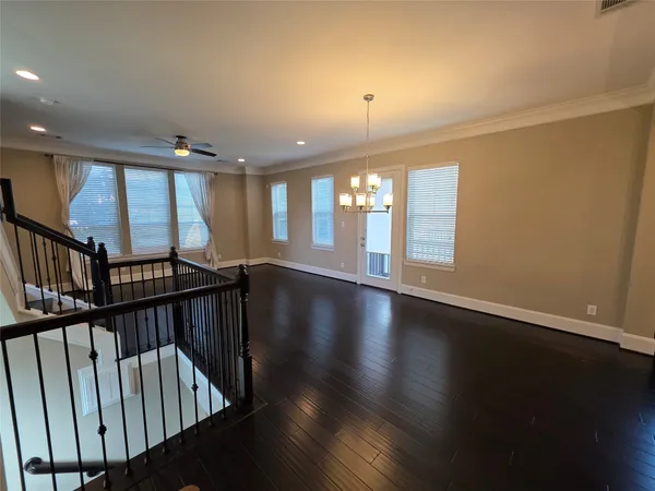 a kitchen with a sink a window and cabinets