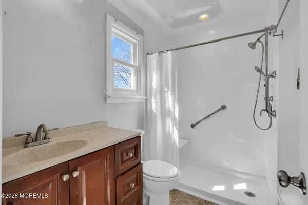 a front view of house with yard and trees