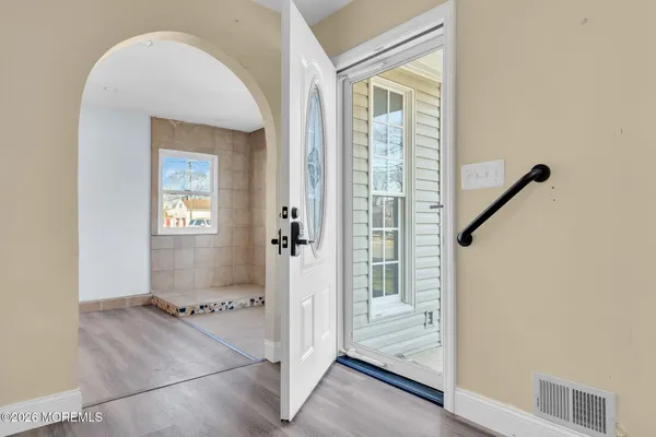 a bathroom with a tub and shower