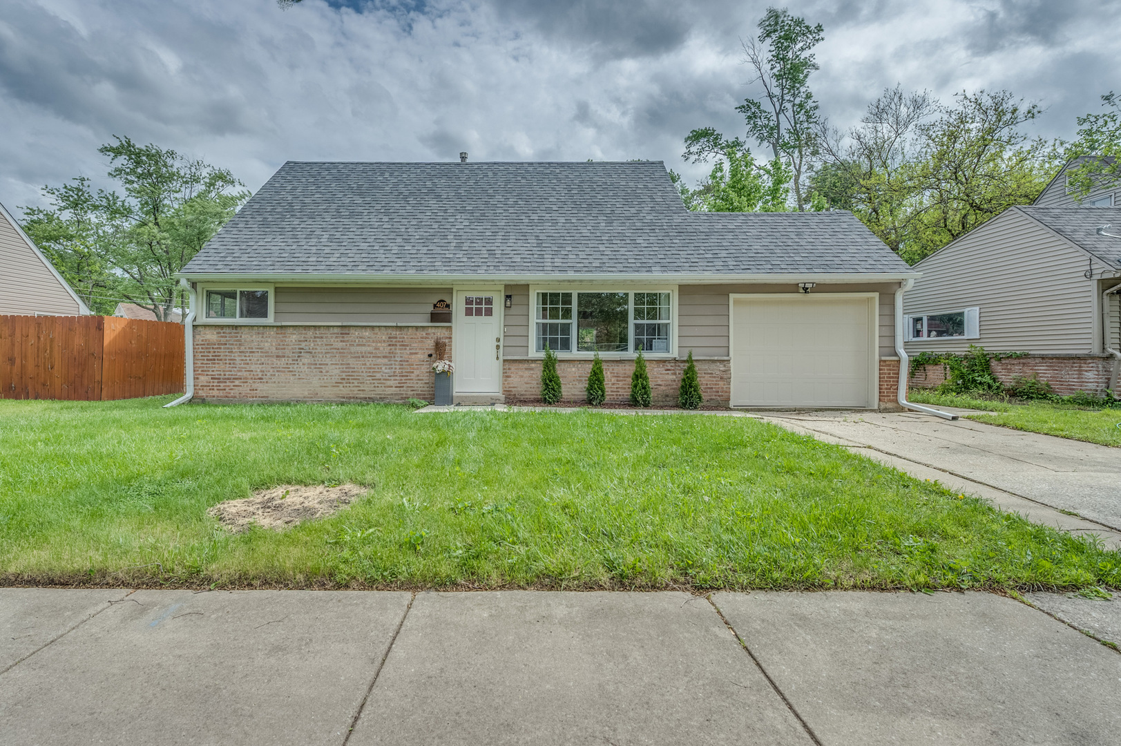 407 Watseka Street Park Forest, IL 60466 - Photo 1 of 21 a front view of house with yard and green space