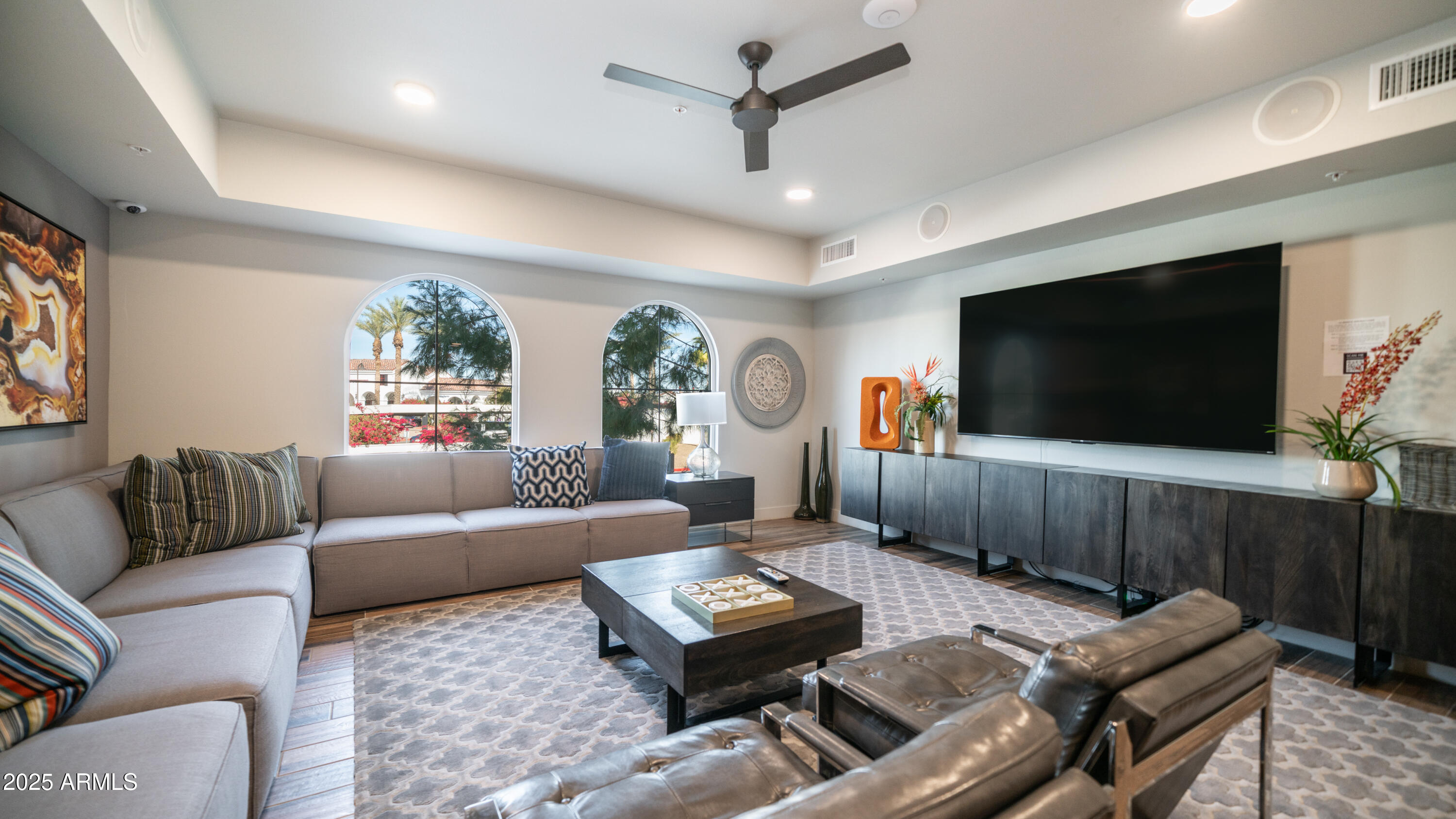 2511 West Queen Creek Road, Unit 166 Chandler, AZ 85248 - Photo 56 of 66 a living room with furniture and a flat screen tv
