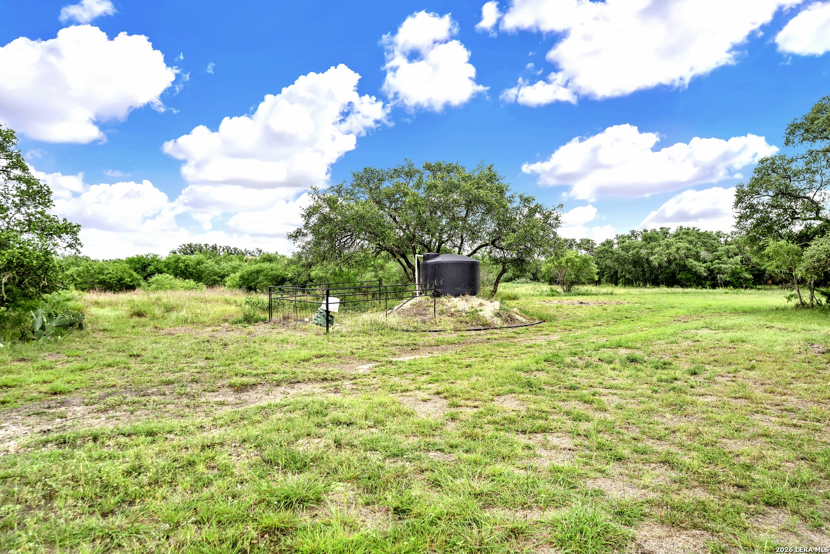 0 Fm 1796 D'Hanis, TX 78850 - Photo 4 of 26 a swimming pool with wooden fence