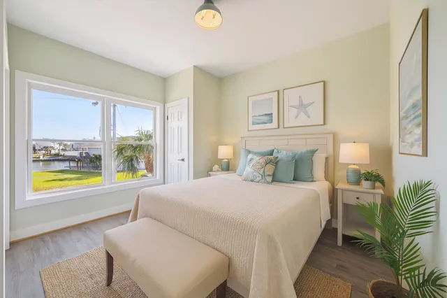 a bedroom with a bed and a couch