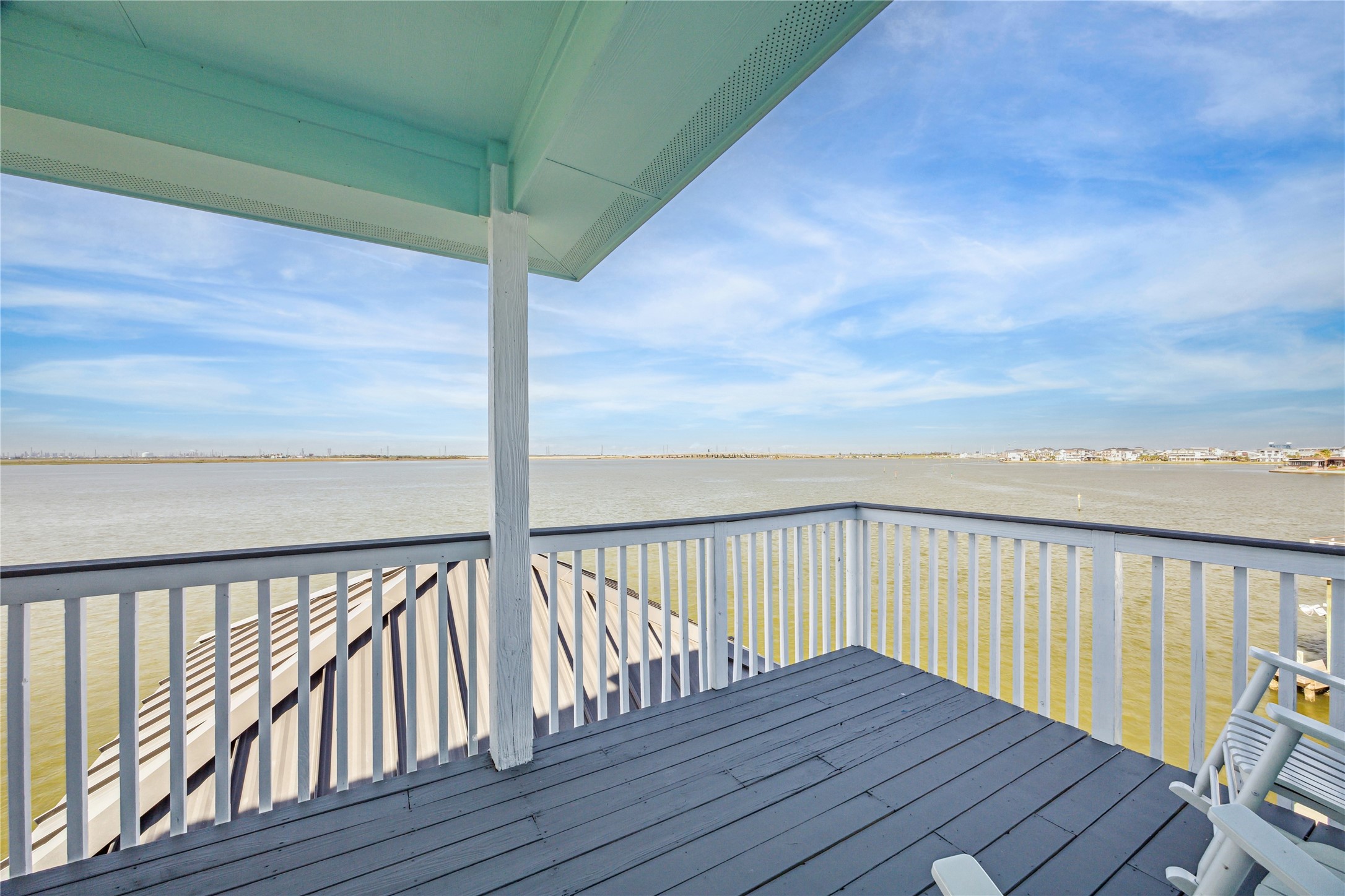 1322 Outrigger Street Tiki Island, TX 77554 - Photo 29 of 46 a view of wooden balcony with two chairs
