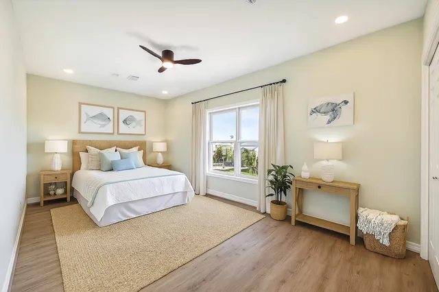 a spacious bedroom with a bed and a couch