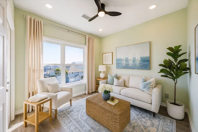 a living room with furniture and a large window