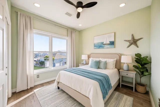 a bedroom with a large bed and a window