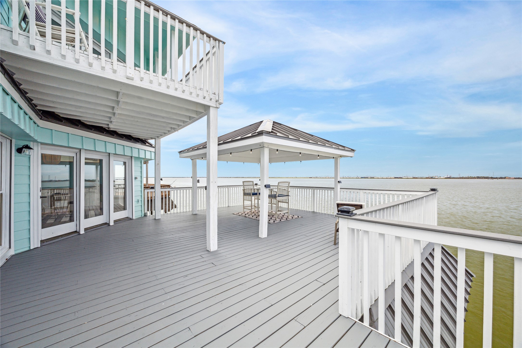 1322 Outrigger Street Tiki Island, TX 77554 - Photo 34 of 46 a roof deck with table and chairs