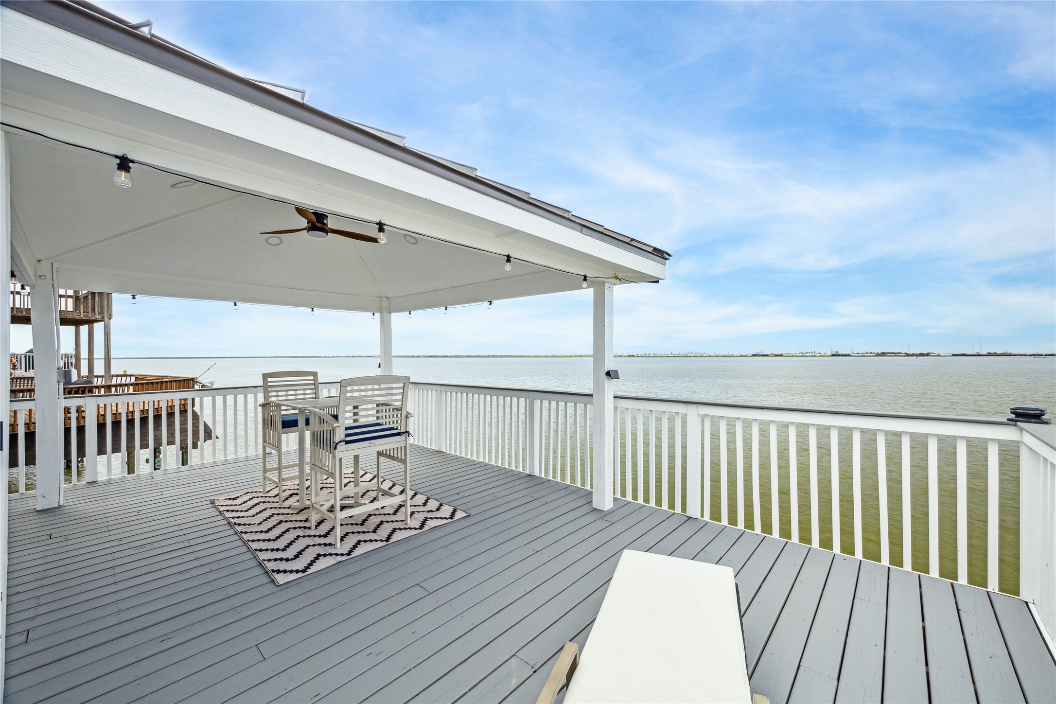 1322 Outrigger Street Tiki Island, TX 77554 - Photo 39 of 46 a view of balcony with wooden floor and seating space