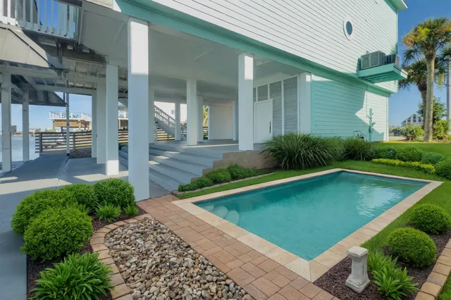 a view of swimming pool with patio