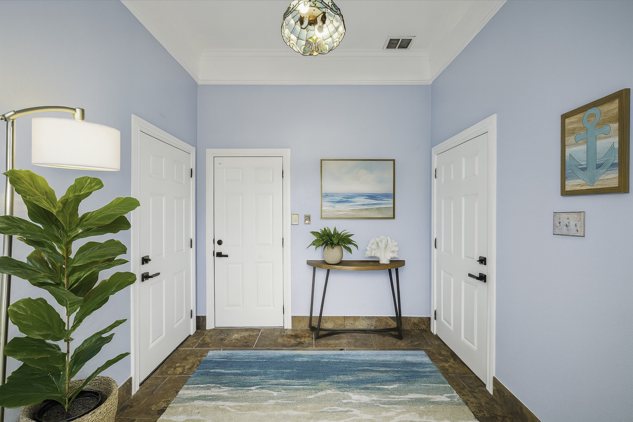 1322 Outrigger Street Tiki Island, TX 77554 - Photo 6 of 46 a living room with stainless steel appliances furniture and a potted plant