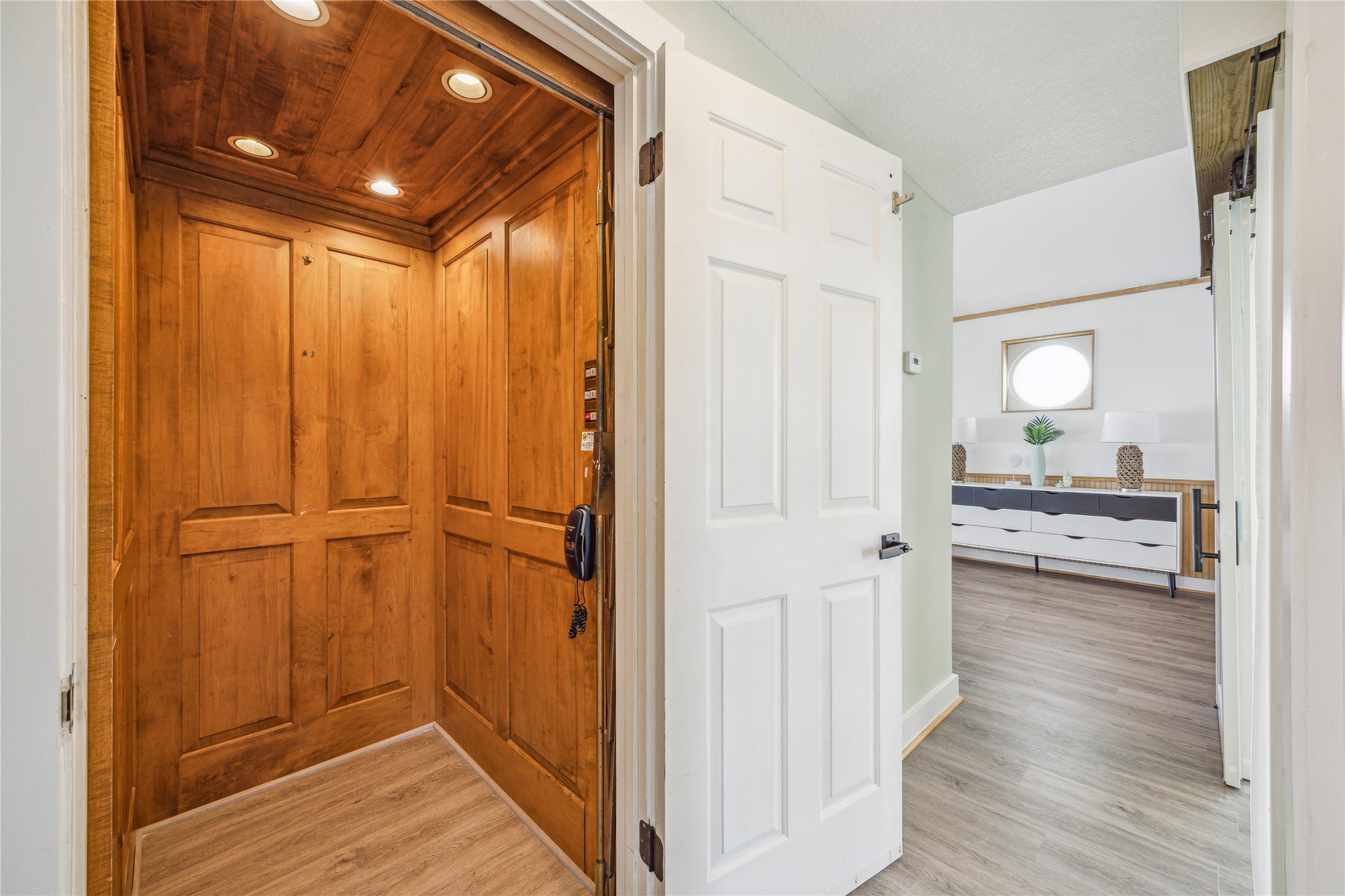1322 Outrigger Street Tiki Island, TX 77554 - Photo 7 of 46 a view of a hallway with wooden floor