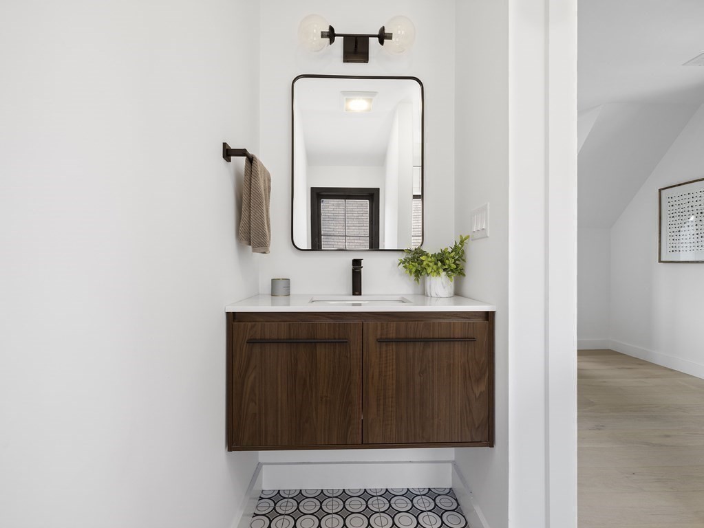 9 B Harrison Road, Unit 9B Somerville, MA 02144 - Photo 13 of 21 a bathroom with a sink and a mirror