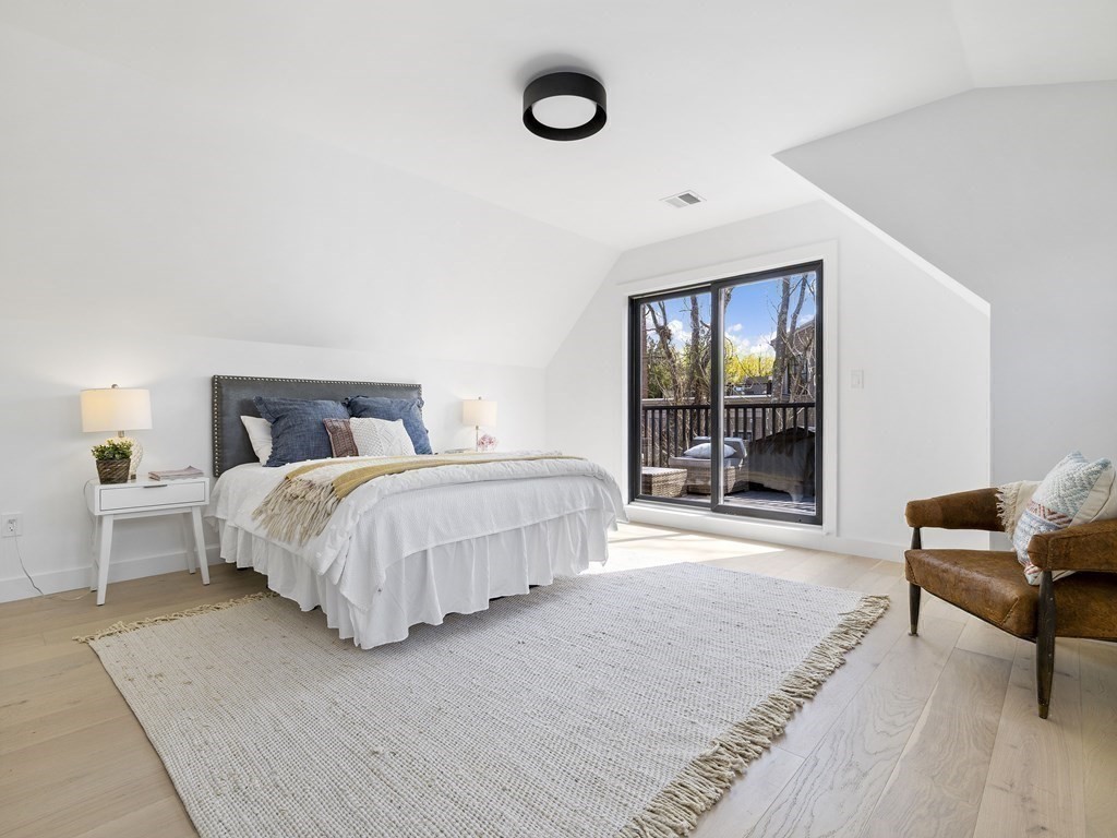 9 B Harrison Road, Unit 9B Somerville, MA 02144 - Photo 14 of 21 a bedroom with a bed and window