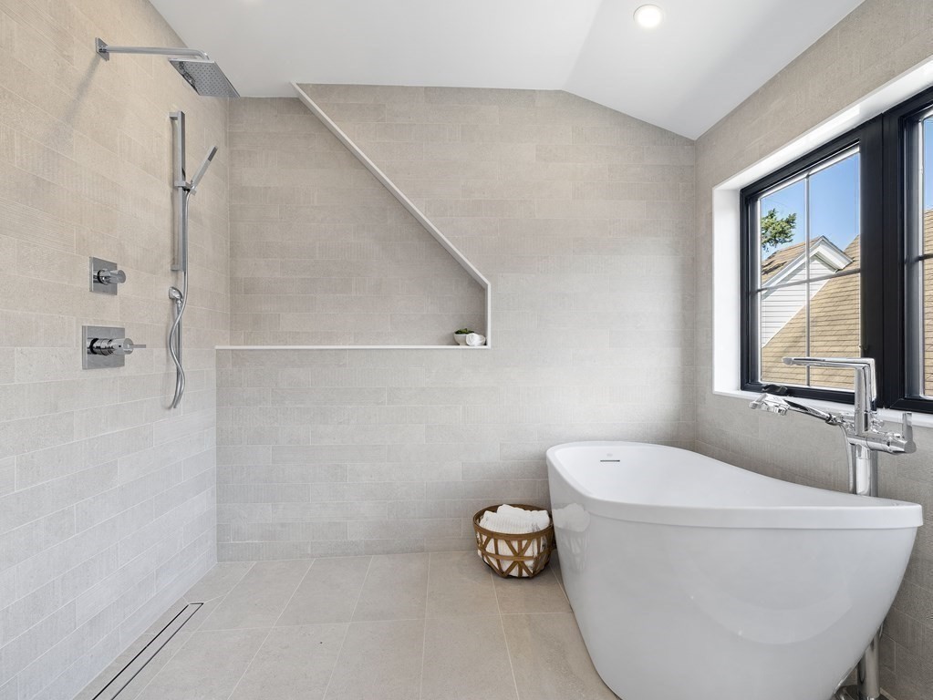 9 B Harrison Road, Unit 9B Somerville, MA 02144 - Photo 15 of 21 a bathroom with a bathtub and a shower