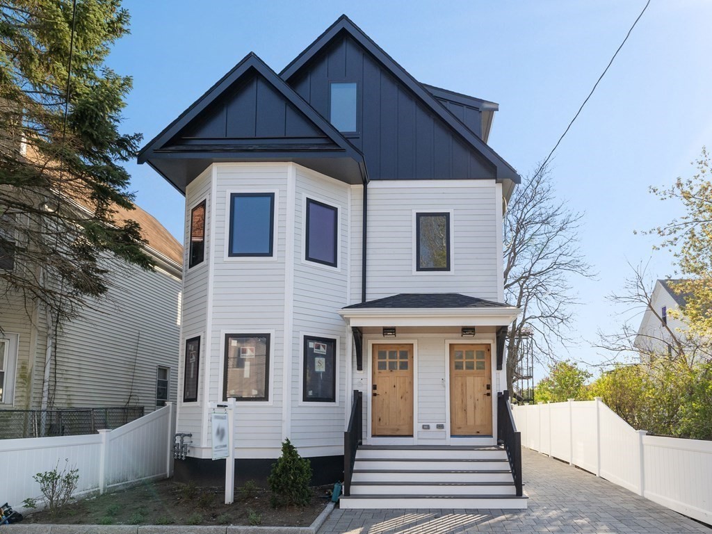9 B Harrison Road, Unit 9B Somerville, MA 02144 - Photo 18 of 21 a front view of a house with a yard