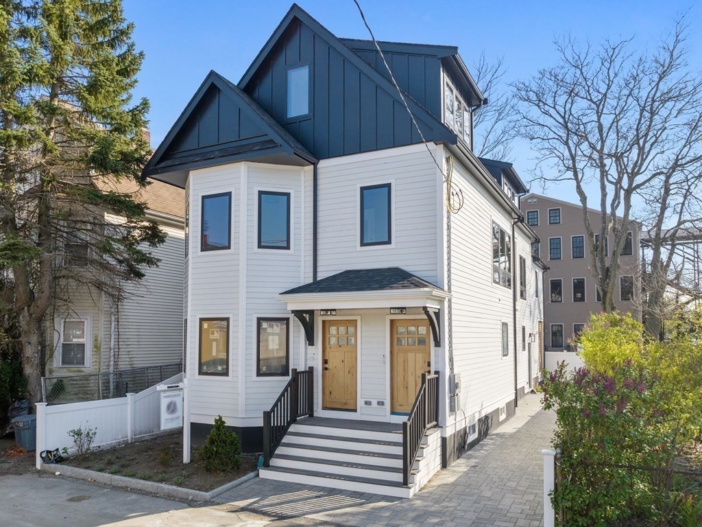 9 B Harrison Road, Unit 9B Somerville, MA 02144 - Photo 19 of 21 a front view of a house with a yard