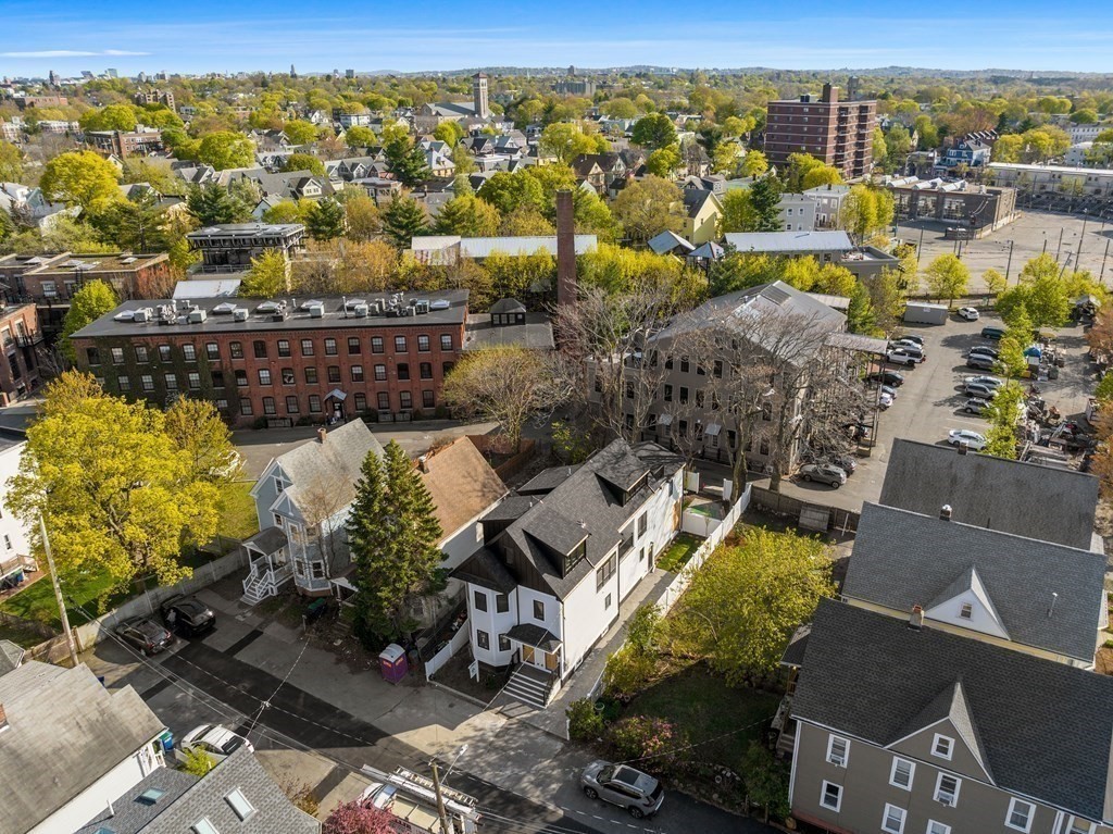 9 B Harrison Road, Unit 9B Somerville, MA 02144 - Photo 21 of 21 an aerial view of a city with lots of residential buildings ocean and mountain view in back