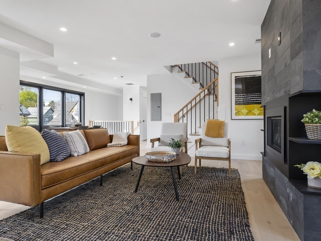 9 B Harrison Road, Unit 9B Somerville, MA 02144 - Photo 3 of 21 a living room with furniture and wooden floor