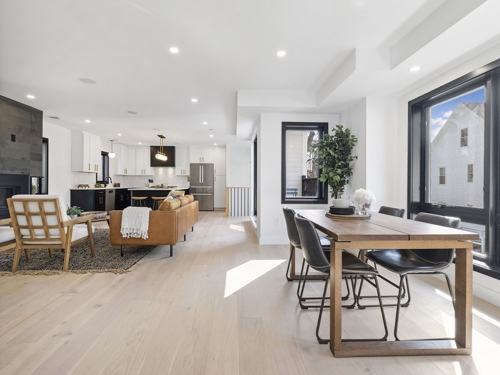 9 B Harrison Road, Unit 9B Somerville, MA 02144 - Photo 4 of 21 a living room with furniture and kitchen view